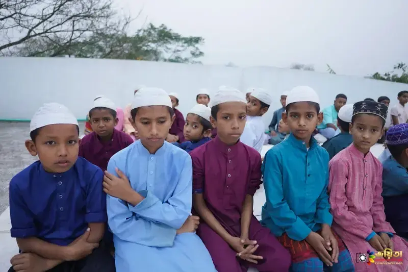 A group of orphan boys sitting together at the campus